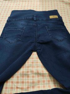 High-Waisted Dark Wash Jeans with Button Detail