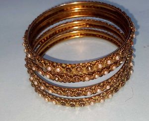 Elegant Gold Bangles with Pearl Embellishments