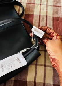 Stylish Black Hobo Bag with Charm