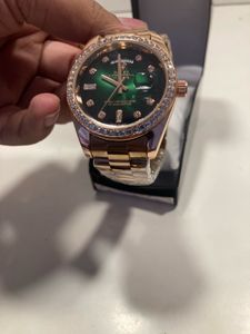 Rose Gold Rolex Watch with Green Dial