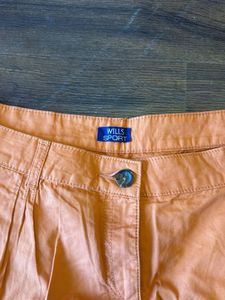 wills lifestyle Chic Orange Pleated Shorts