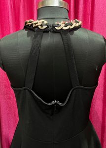 Chic Black Peplum Top with Chain Detail