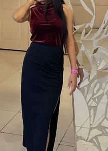 velvet maroon top paired with long black skirt wit