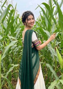 Elegant White Saree with Dark Green Border