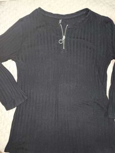 The image features a black ribbed top characterize