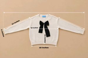 IVORY SWEATER WITH BLACK BOW