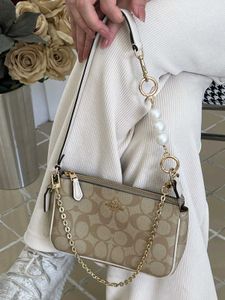 COACH NOLITA DAISY APPLIQUE BAG, FEATURE WITH A PE