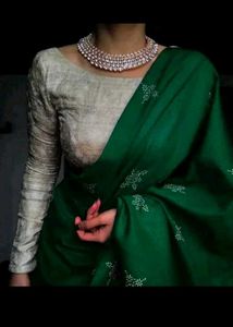 Elegant Green Silk Saree with Pearl Necklace