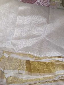 Elegant White and Gold Saree Onam
