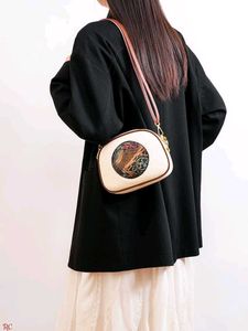 Chic Elephant Embossed Crossbody Bag