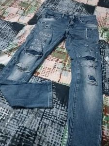 Distressed Blue Denim Jeans