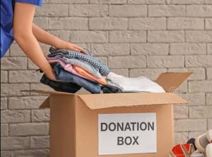 Donation box containing branded clothes - women