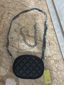 Black Quilted Oval Crossbody Bag