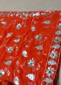 Elegant Orange Saree with Silver Embellishments