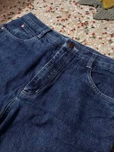 Flared Denim Jeans with Frayed Hem