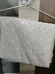 Elegant White Saree with Silver Motifs