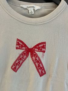 Cream T-Shirt with Red Bow Design