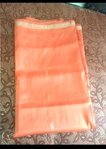 Vibrant Orange Saree with Golden Border