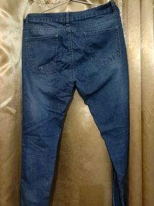 Distressed Blue Denim Jeans