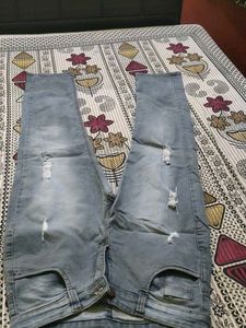 Distressed Blue Denim Jeans