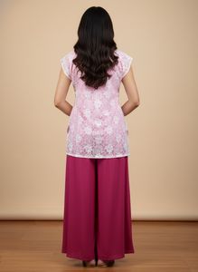 Pink Lace Topwith Magenta bottom wear.