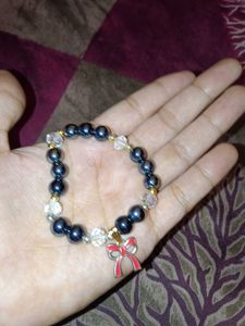Charming Beaded Bracelet with Bow Charm
