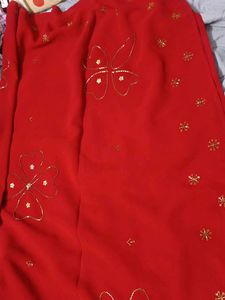 Vibrant Red Saree with Golden Embellishments