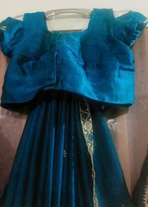 Elegant Teal Saree with Gold Embellishments