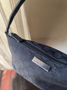 Gucci Monogram boat pochette bag
