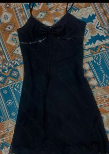 Chic Black Slip Dress with Embellished Neckline