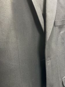 A Raymond Suit of rich dark greenish black colour