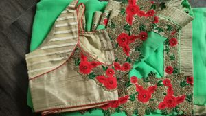 green colour saree with heavy cutwork border in pallu and golden work border all ever with stitched blouse