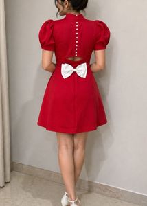 Red Dress with White Bow Accent