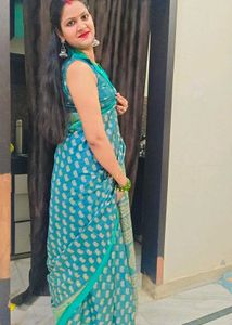 Elegant Teal Saree with Intricate Gold Patterns