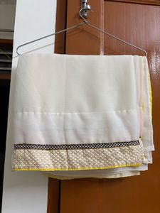 Elegant Cream Saree with Golden Border