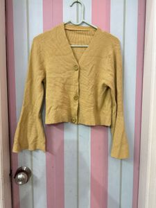 beige flared cardigan