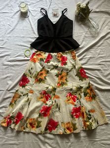 Chic Black Peplum Top & Floral Skirt Set