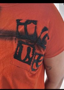 Edgy Orange Graphic Crop Top