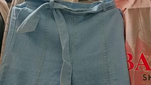 Light Wash Flare Jeans with Tie Detail