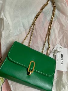 Green Crossbody Bag with Gold Chain.