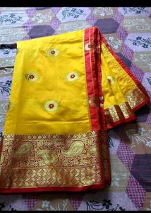Vibrant Yellow Silk Saree with Red Border