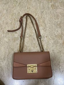 beige sling bag