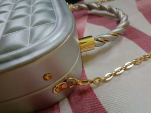 Elegant Silver Clutch with Gold Chain