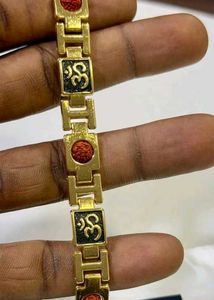 Elegant Gold-Tone Bracelet with Charm Accents