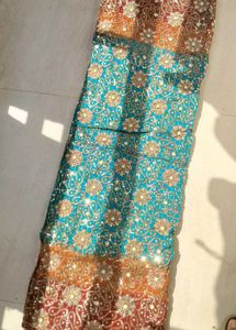 Stunning Teal Saree with Intricate Embellishments