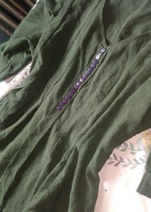 Elegant Green Top with Purple Accents