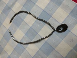 Gun metal neck piece