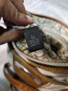 Authentic Guess snake patterned sling Bag