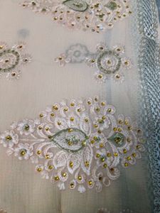Elegant Cream Embroidered Saree