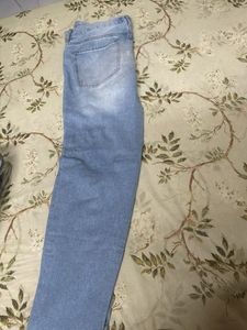 Distressed Light Wash Denim Jeans